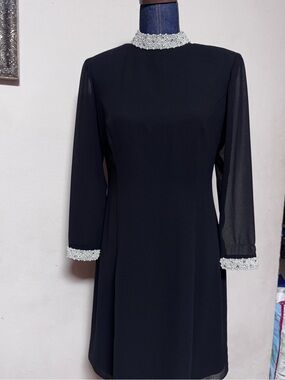 Julian Wilder by Ann Hobbs black dress with beaded trim on collar and cuffs